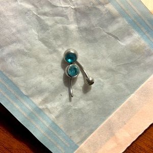Two baby blue belly rings